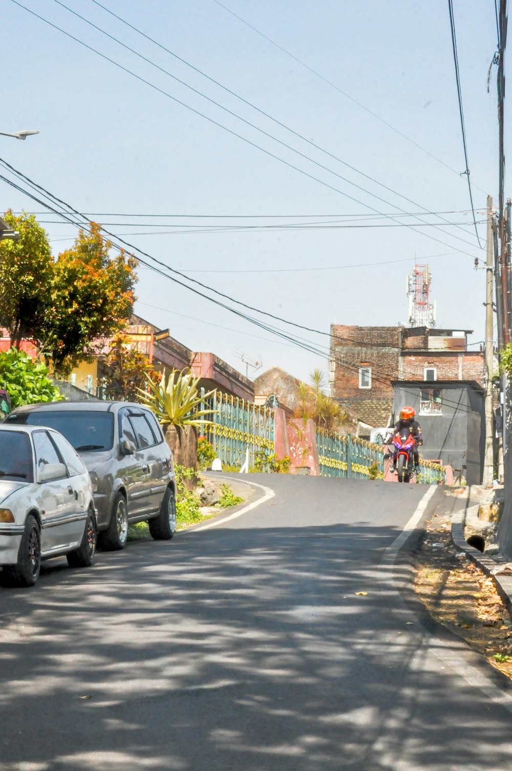 a person riding a motorcycle down a street