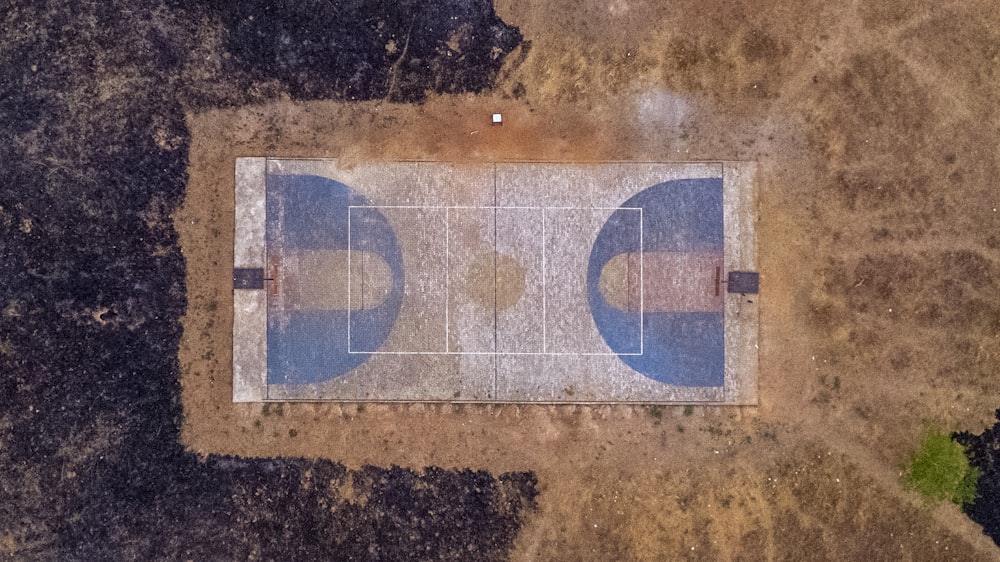 an aerial view of a tennis court in the middle of nowhere