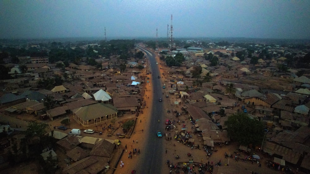 an aerial view of a village and a road