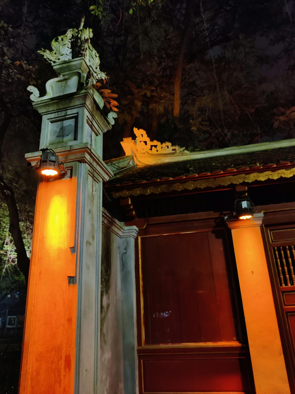 a tall clock tower sitting under a night sky