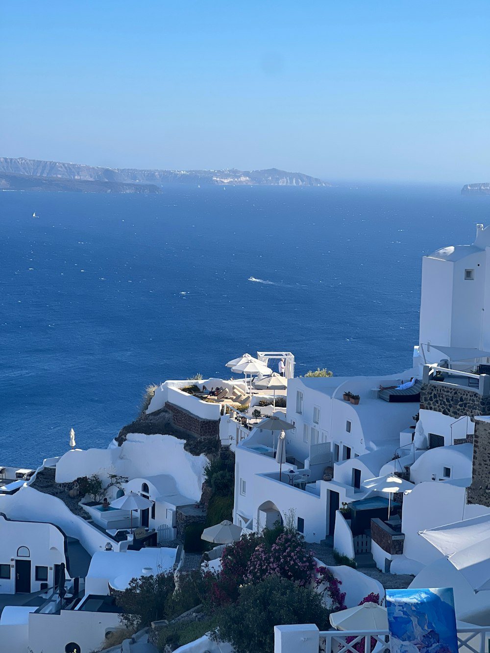 a view of the ocean from the top of a hill