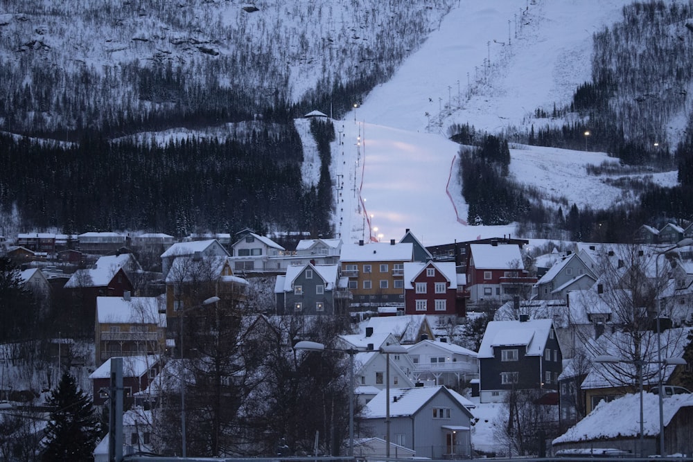 a town with a ski slope in the background