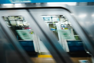 a blurry photo of a subway train with its doors open
