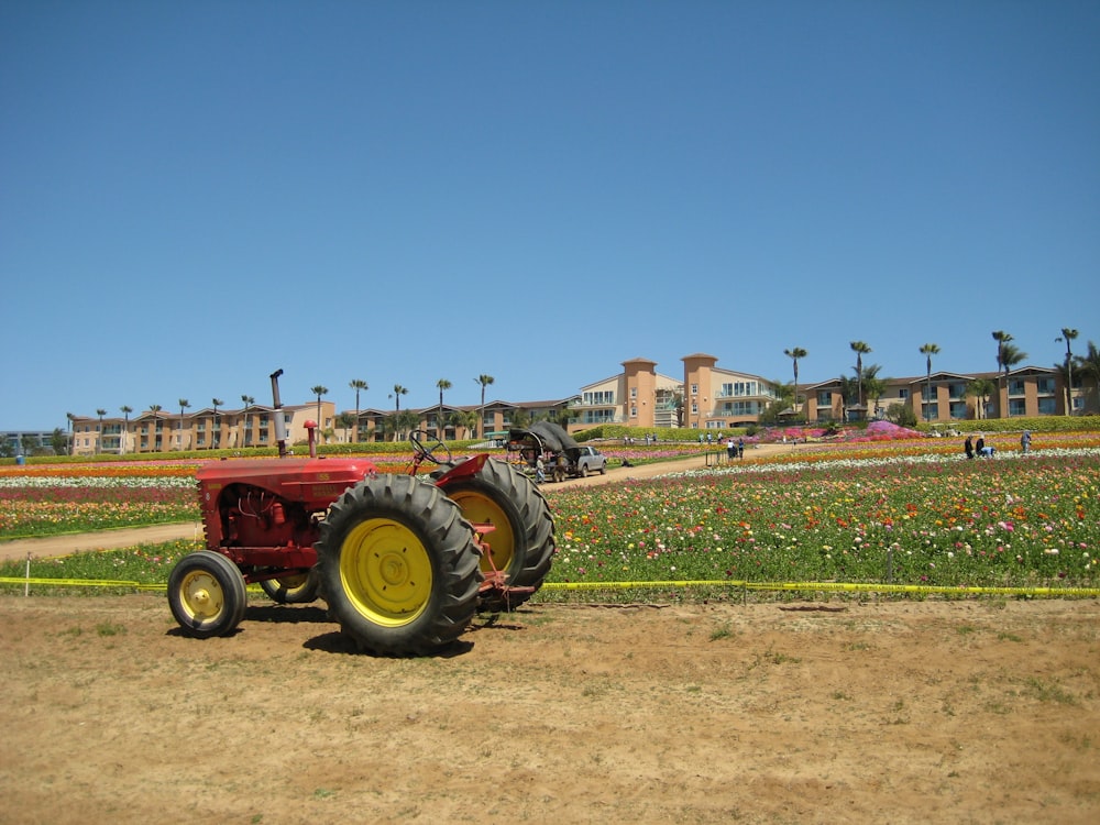 a tractor parked in a field with a building in the background