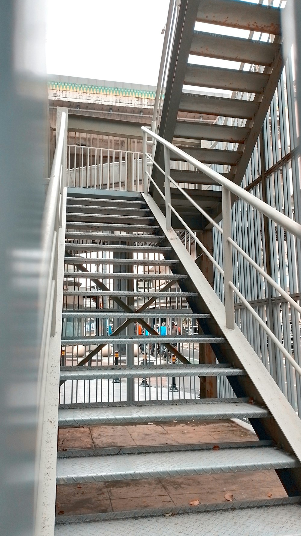 there is a metal stair case on the side of a building