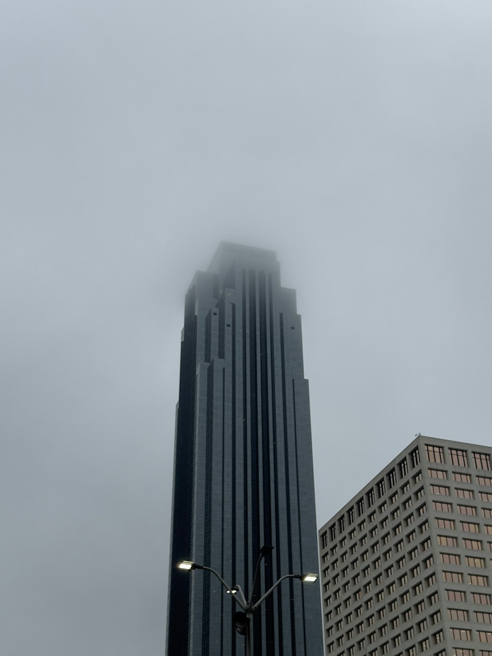 a tall building with a street light in front of it