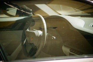 the interior of a car with a steering wheel