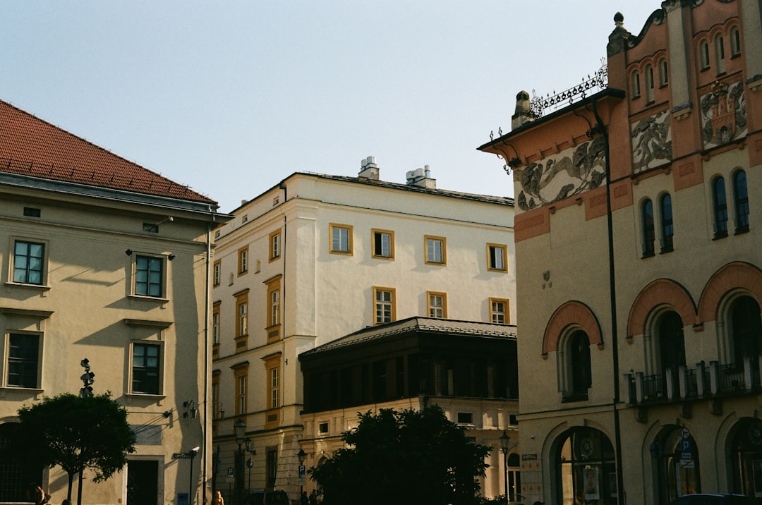 a row of buildings with a clock tower on top,