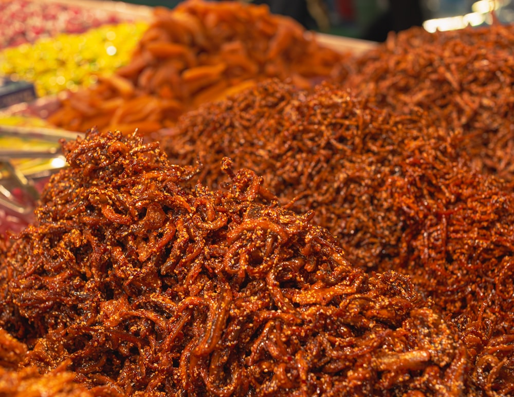 a pile of fried food sitting on top of a table