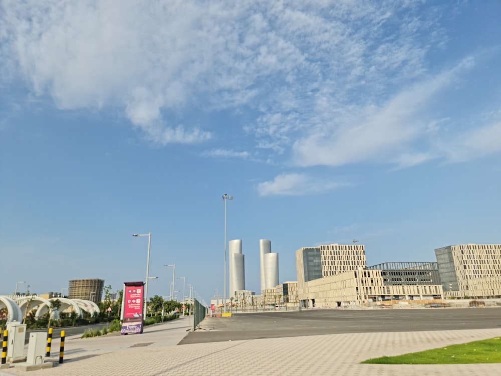 an empty parking lot in front of a large building