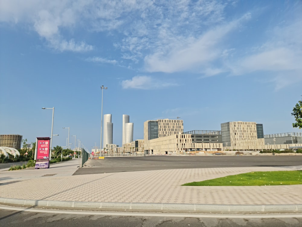 an empty parking lot in front of a large building