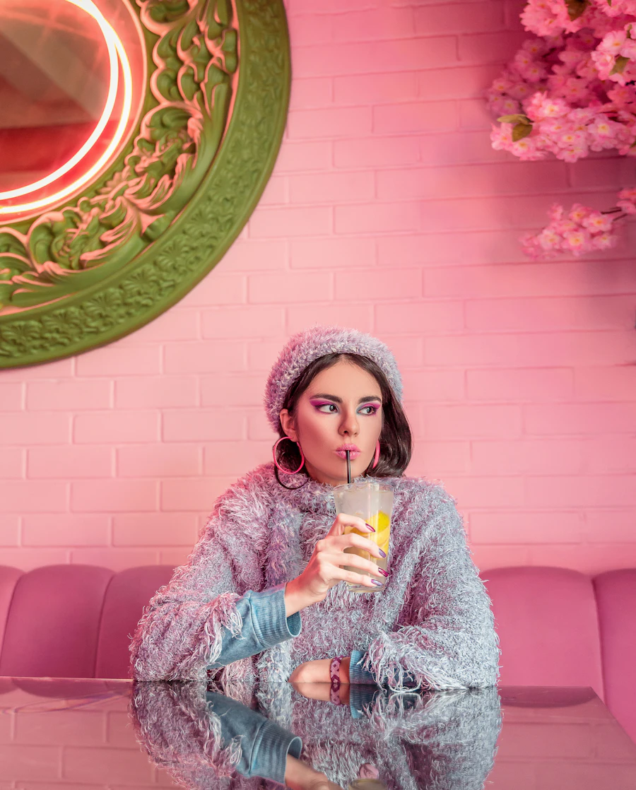 A regular sipping a drink in a vibrant, colourful cafe