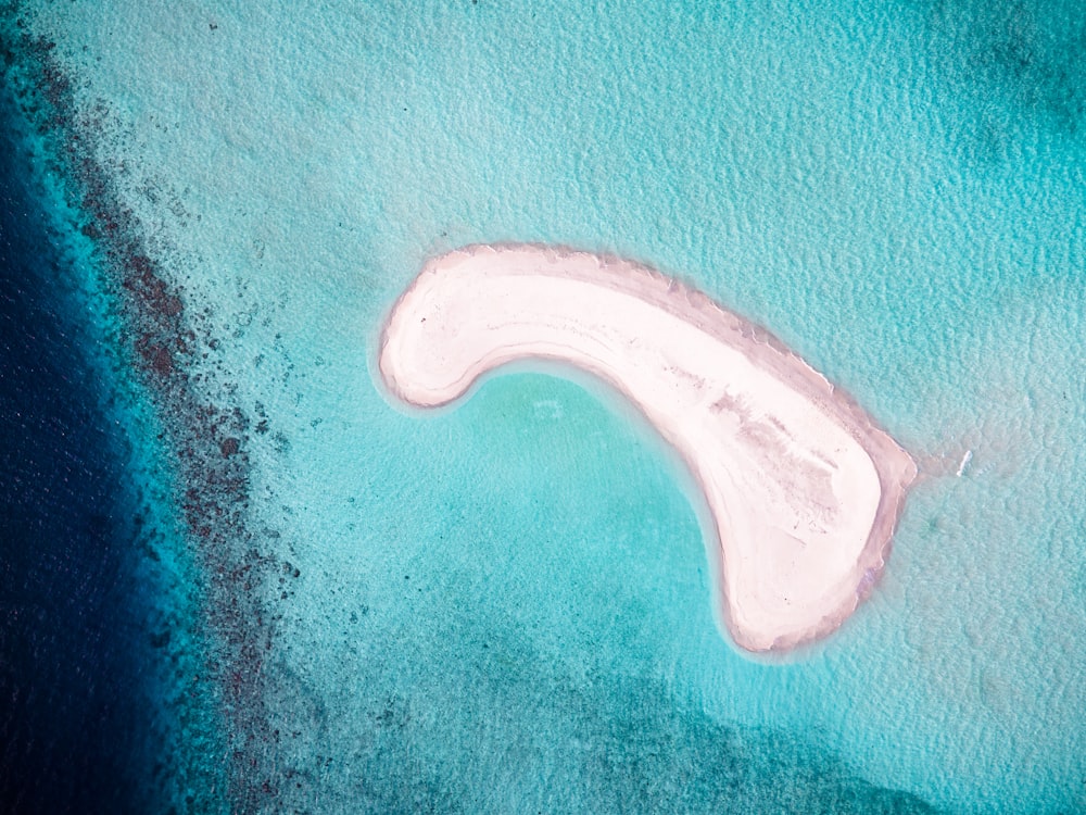 an aerial view of an island in the middle of the ocean