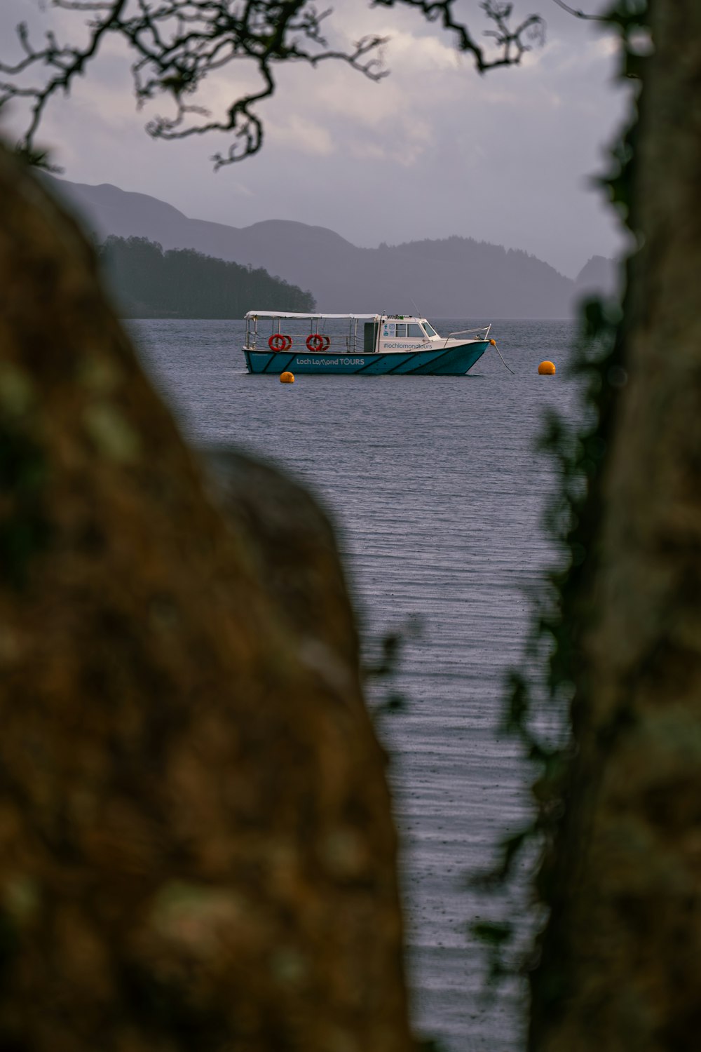 a boat floating on top of a large body of water