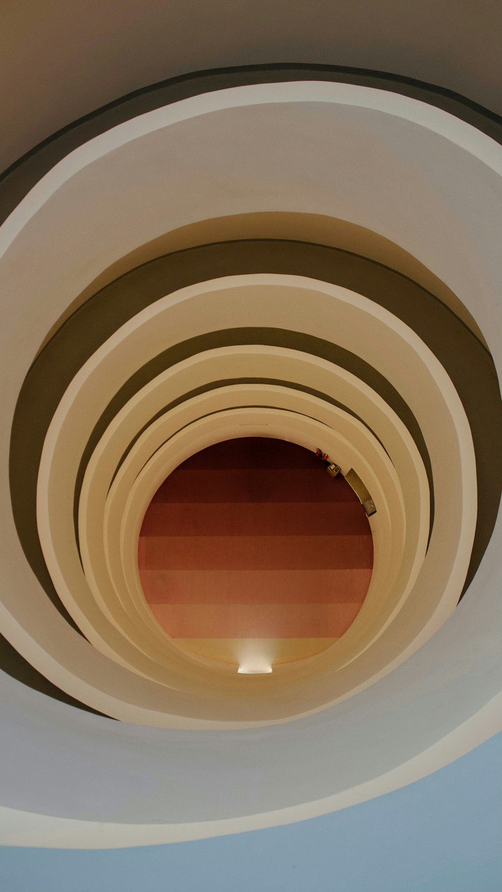 a circular light fixture in a circular room