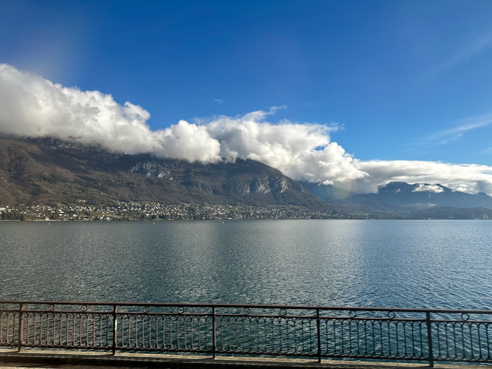 a large body of water with mountains in the background