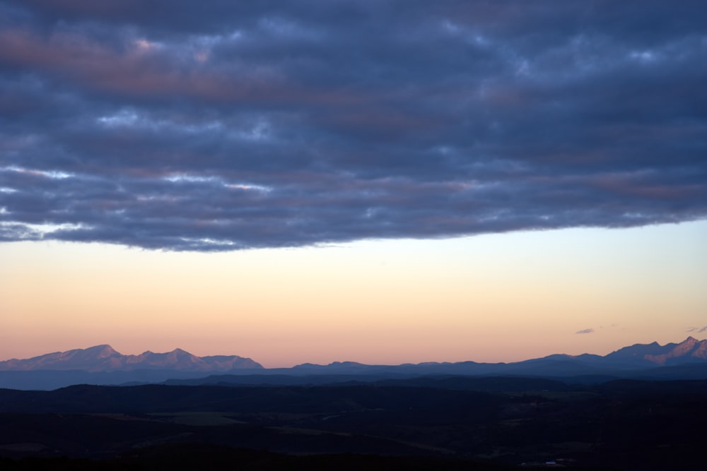 a view of a mountain range at sunset