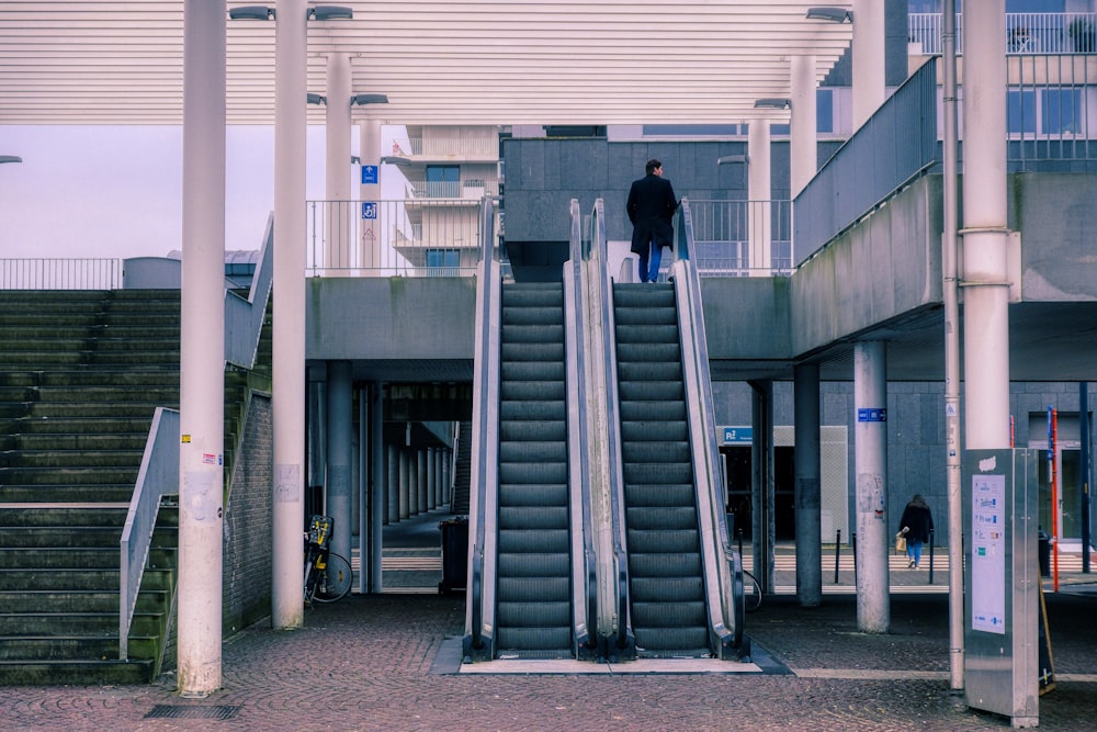 a man standing on top of a set of stairs