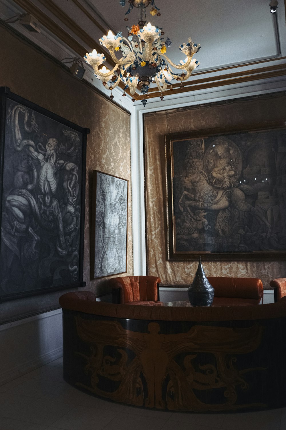 a living room filled with furniture and a chandelier