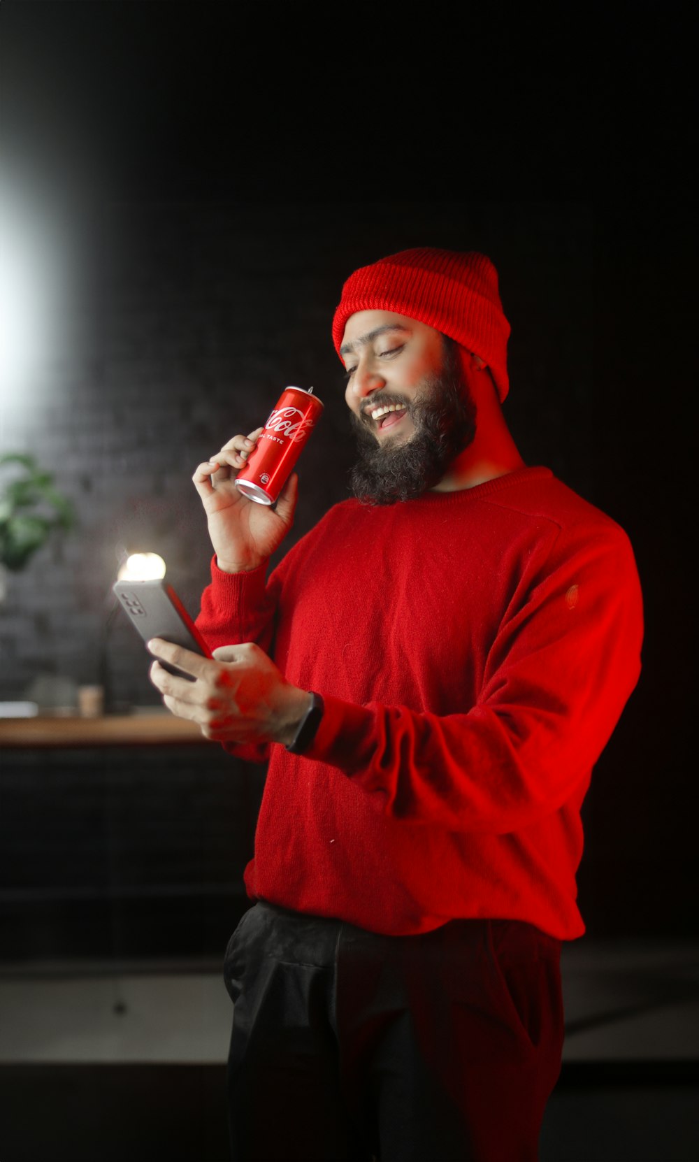 a man in a red hat holding a red lighter