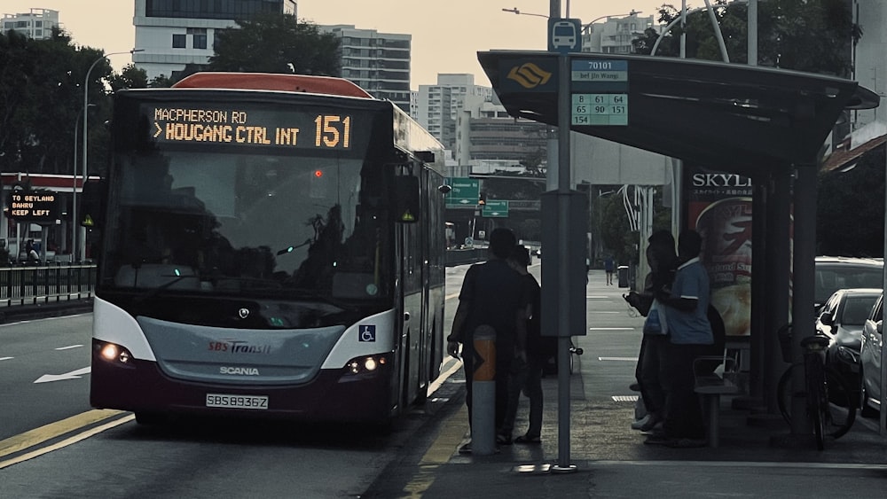 a bus stopped at a bus stop on a city street