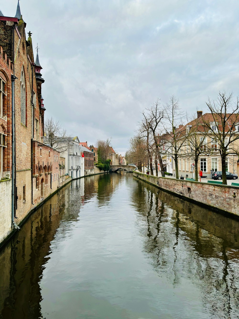 a river running through a city next to tall buildings