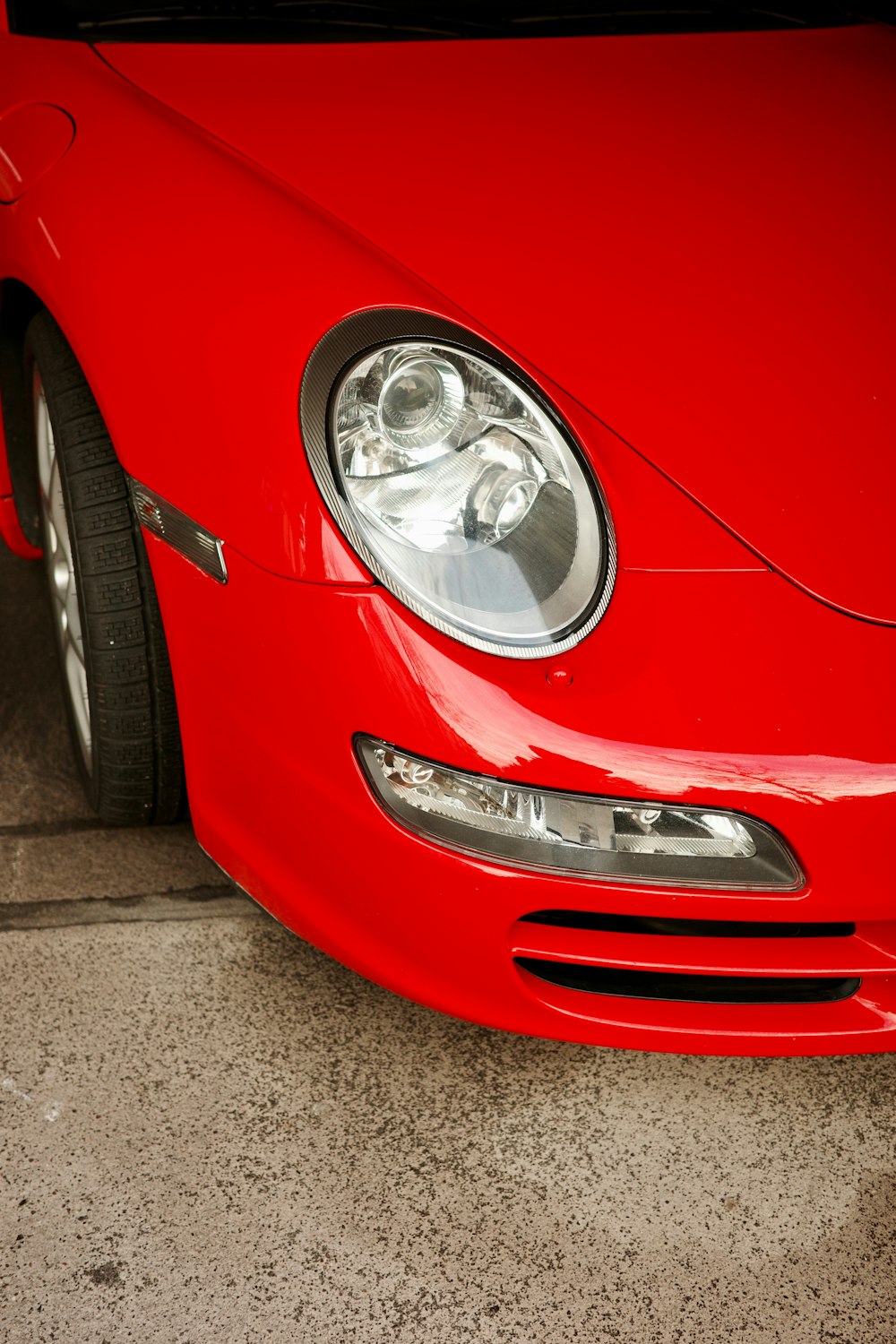 a close up of a red sports car