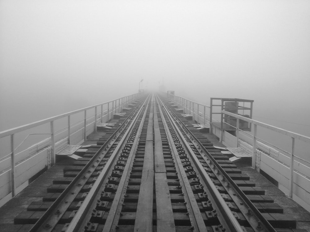 a black and white photo of a train track