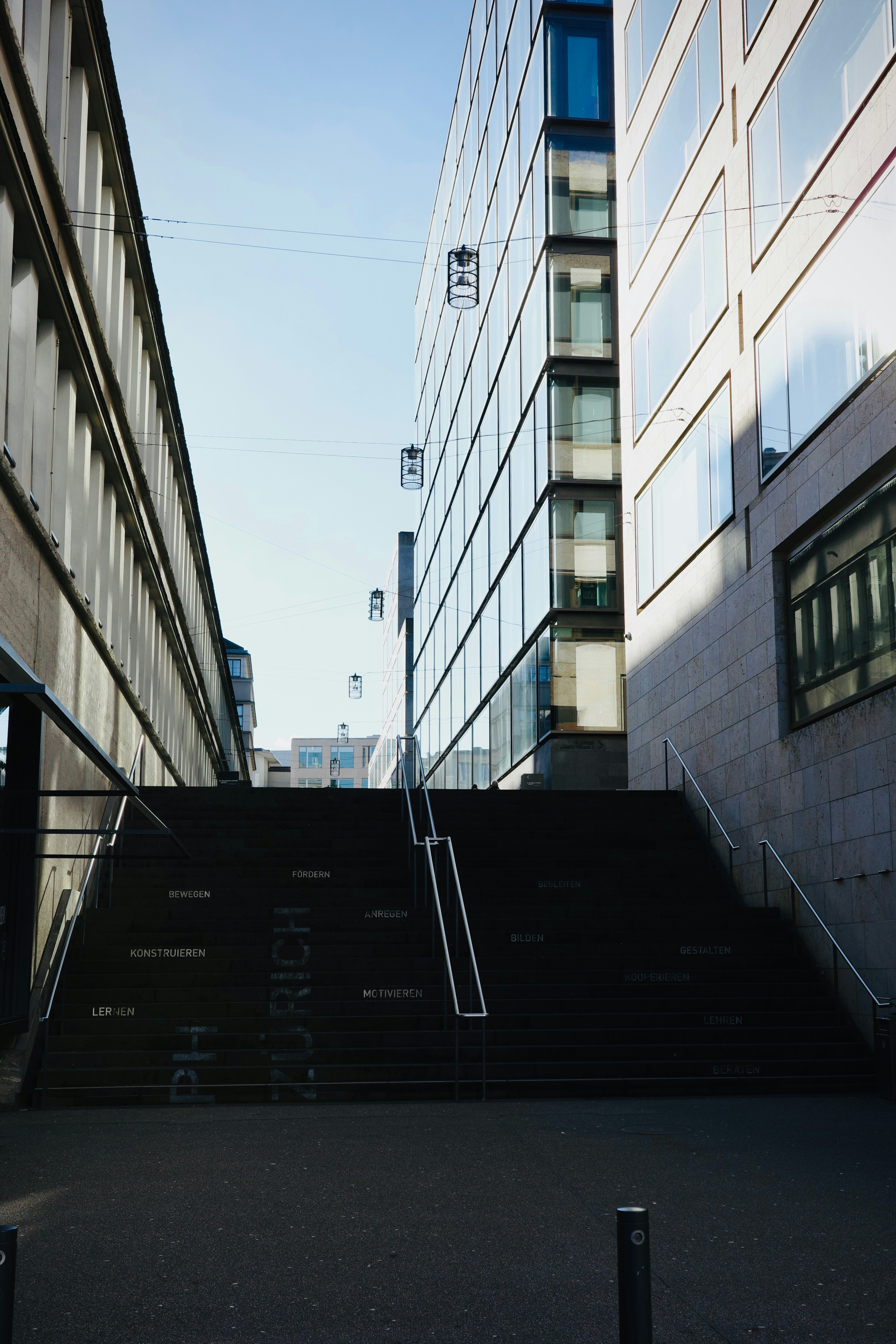 a stairway leading up to a tall building