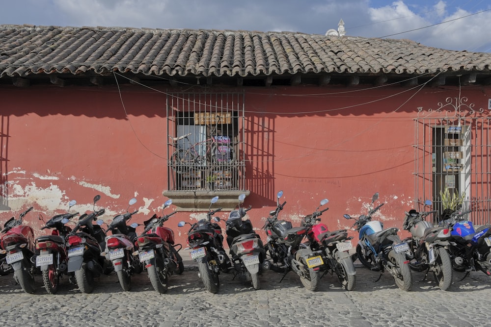 a group of motorcycles parked in front of a building