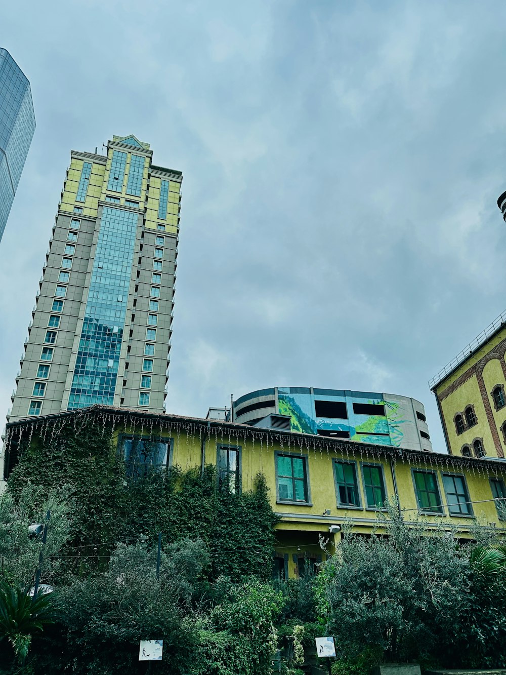 a tall building with a train on top of it