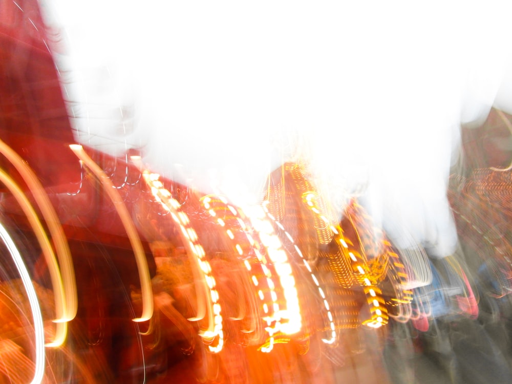 a blurry photo of a carnival ride at night