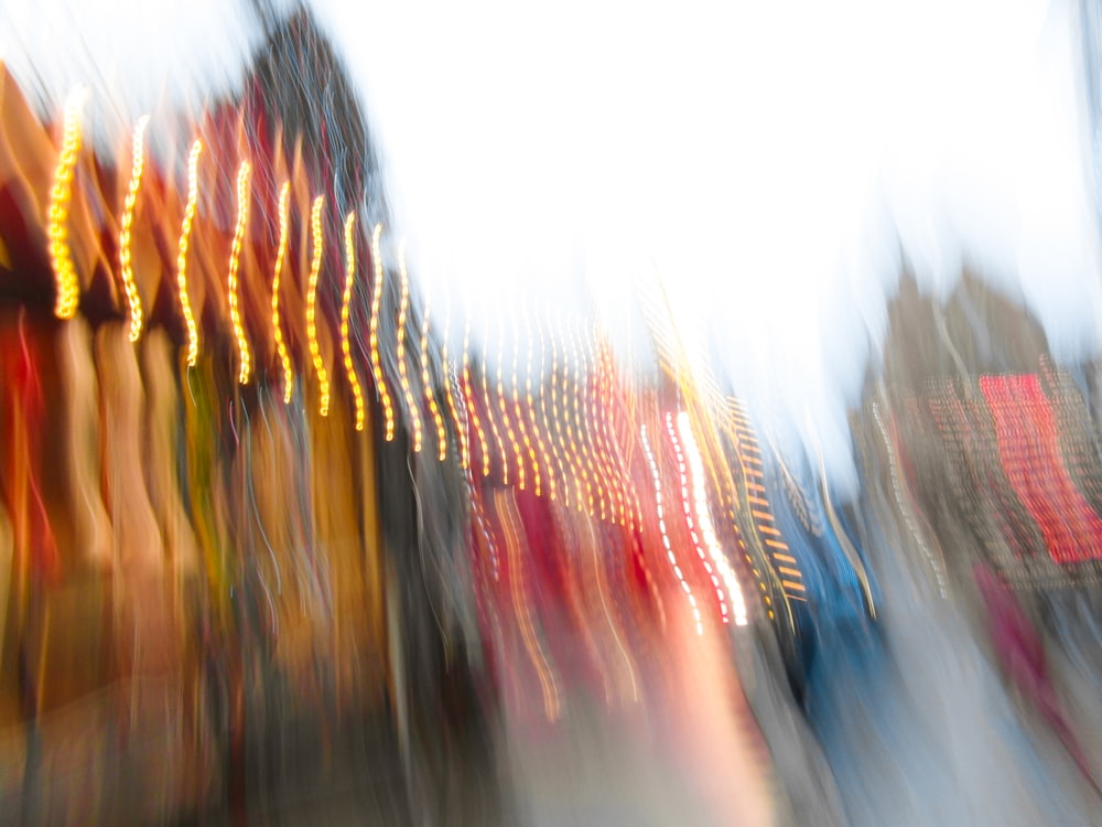 a blurry photo of a carnival ride at night