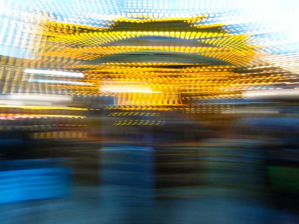 a blurry photo of a carnival ride