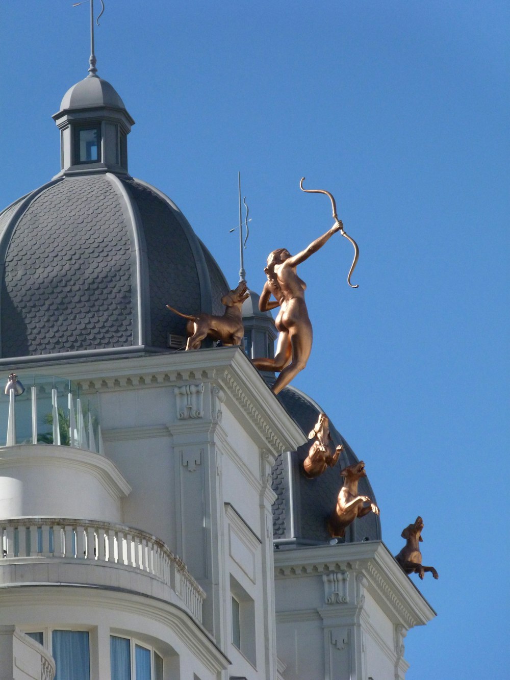 a statue of a man on top of a building