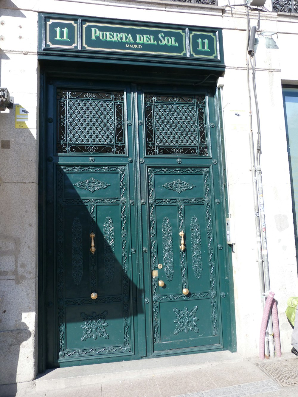 a green door with ornate carvings on it