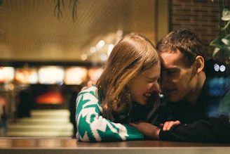 a man and a woman embracing each other