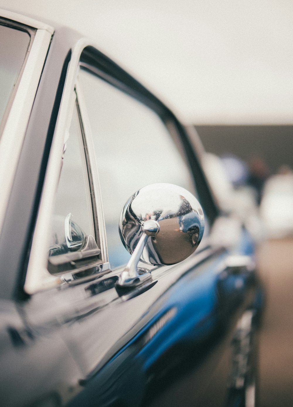 a close up of a car's side mirror