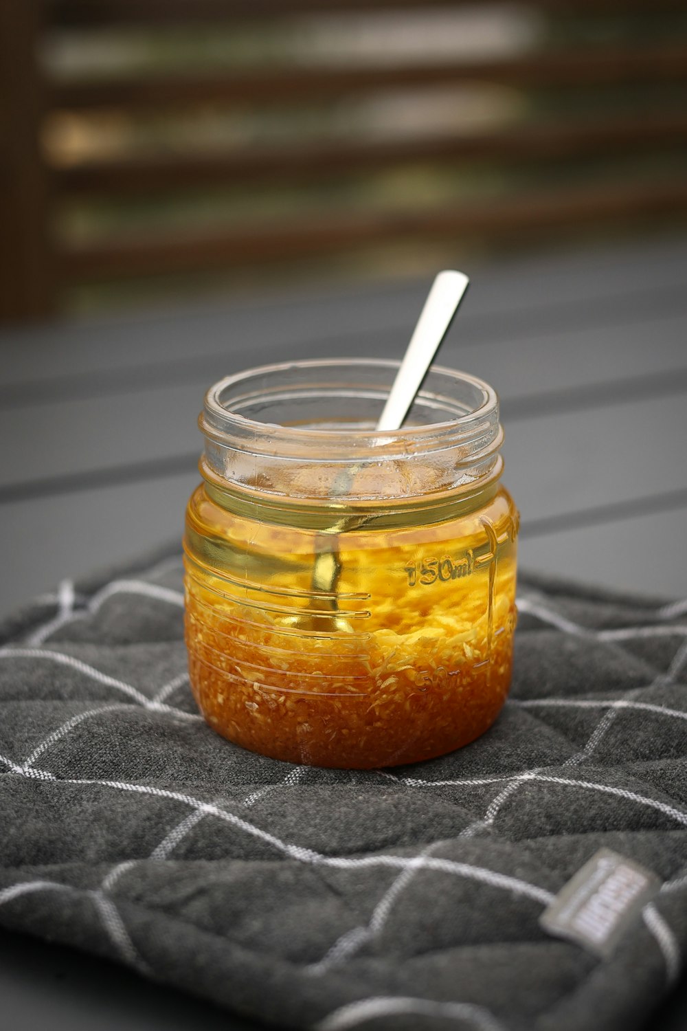 a jar filled with liquid sitting on top of a table