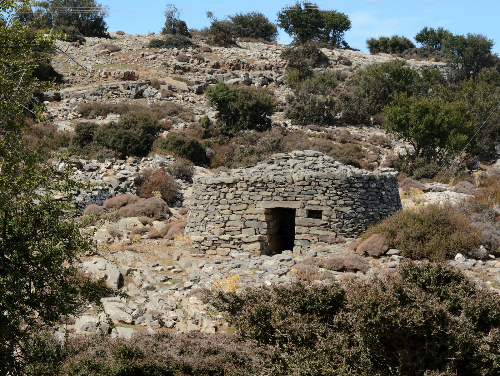 Stone chapel on a wooded hillside near Ephesus, evoking the House of the Virgin Mary