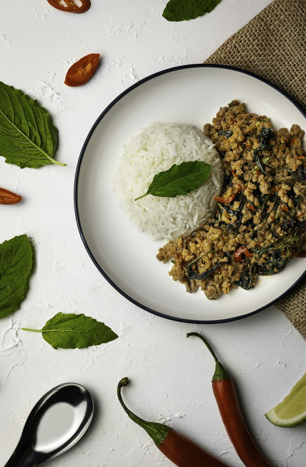 a white plate topped with rice and vegetables