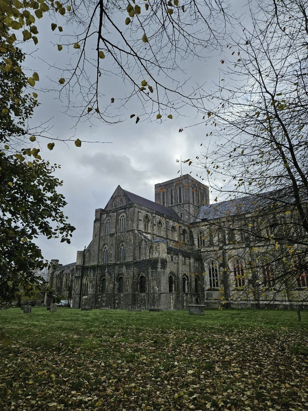 a large building sitting on top of a lush green field