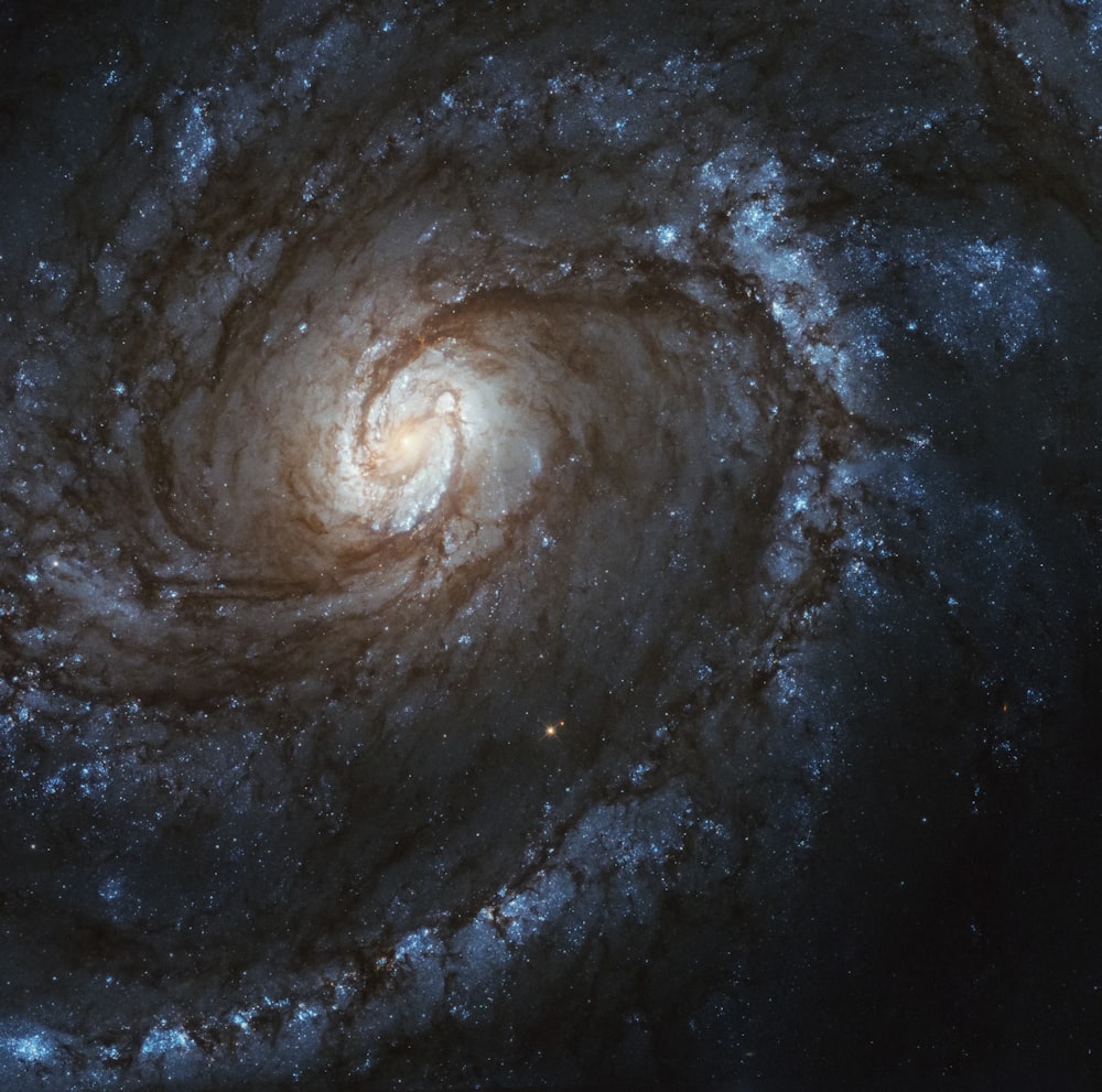 a spiral galaxy with stars in the background