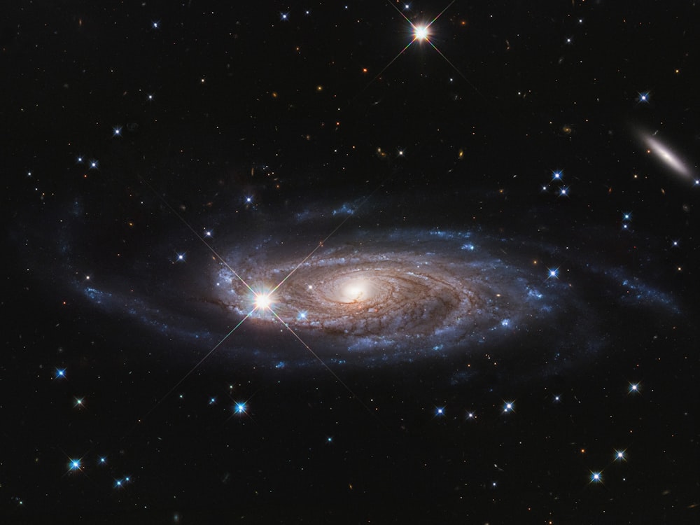 a spiral galaxy with stars in the background