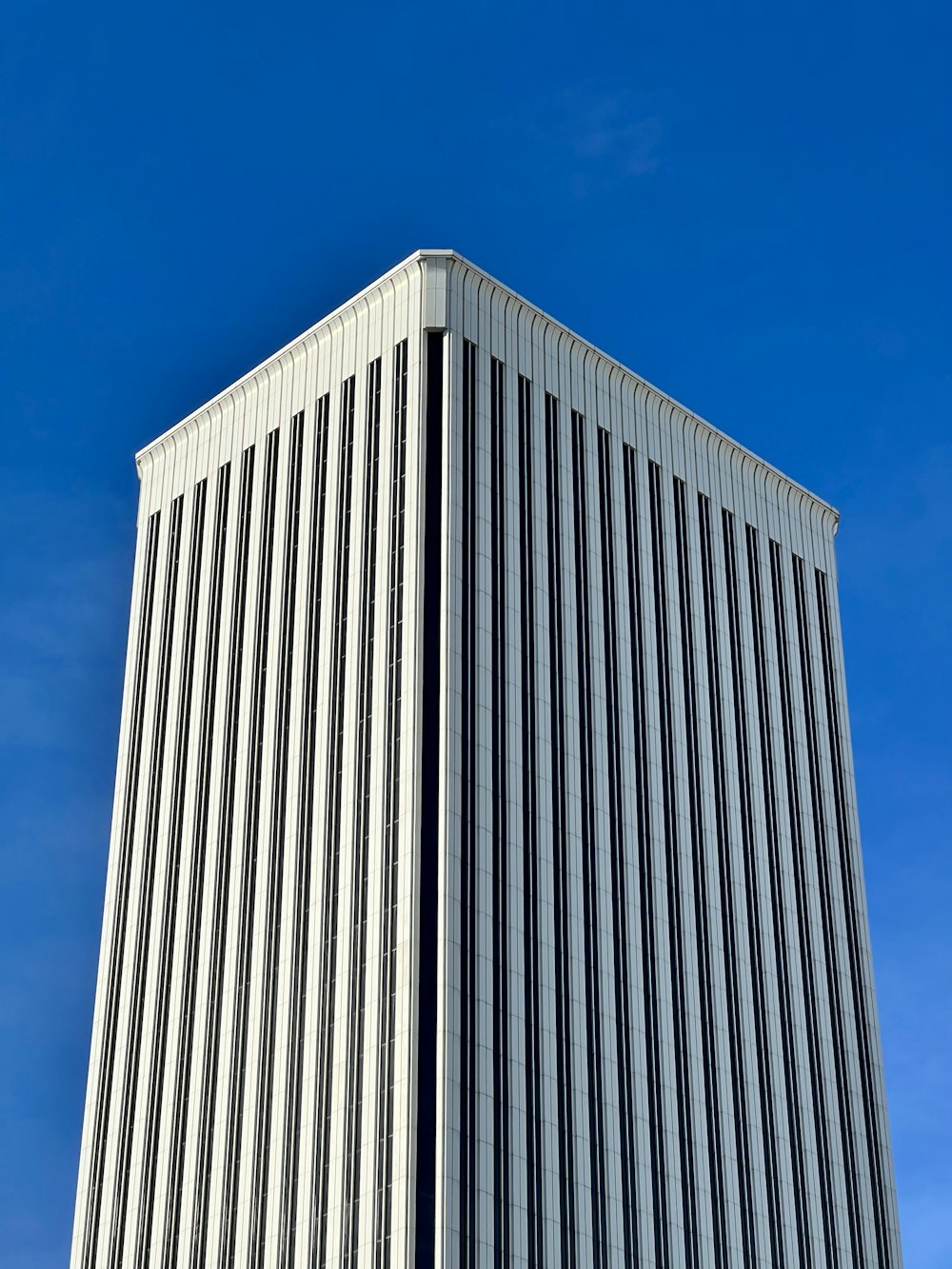 a tall building with a clock on the top of it