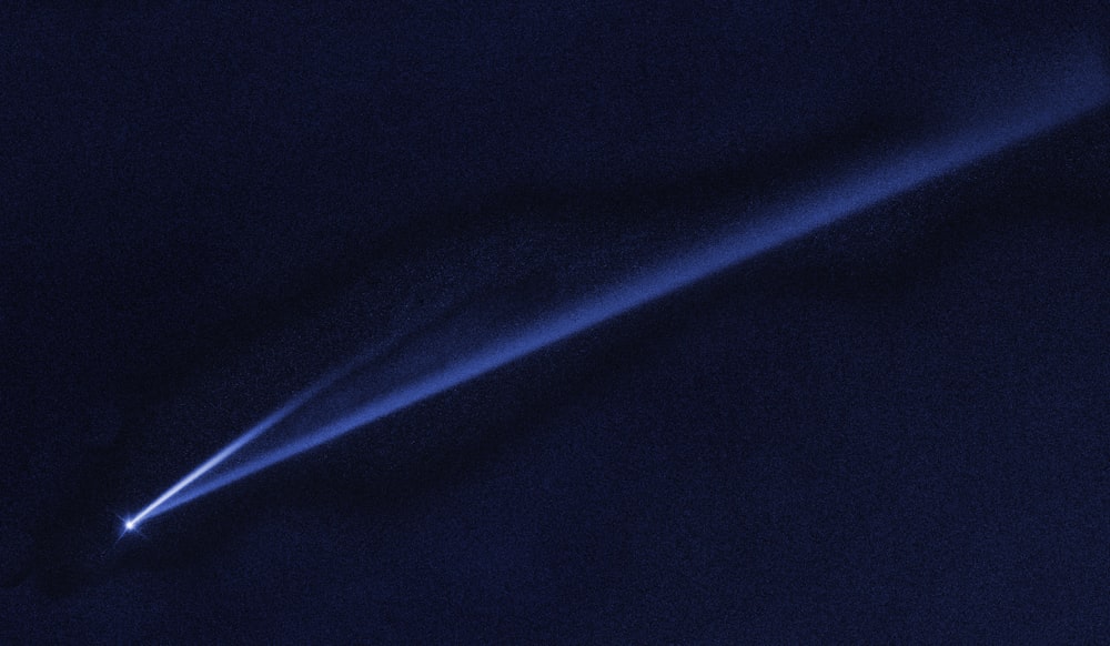 a light emitting from the top of a dark object