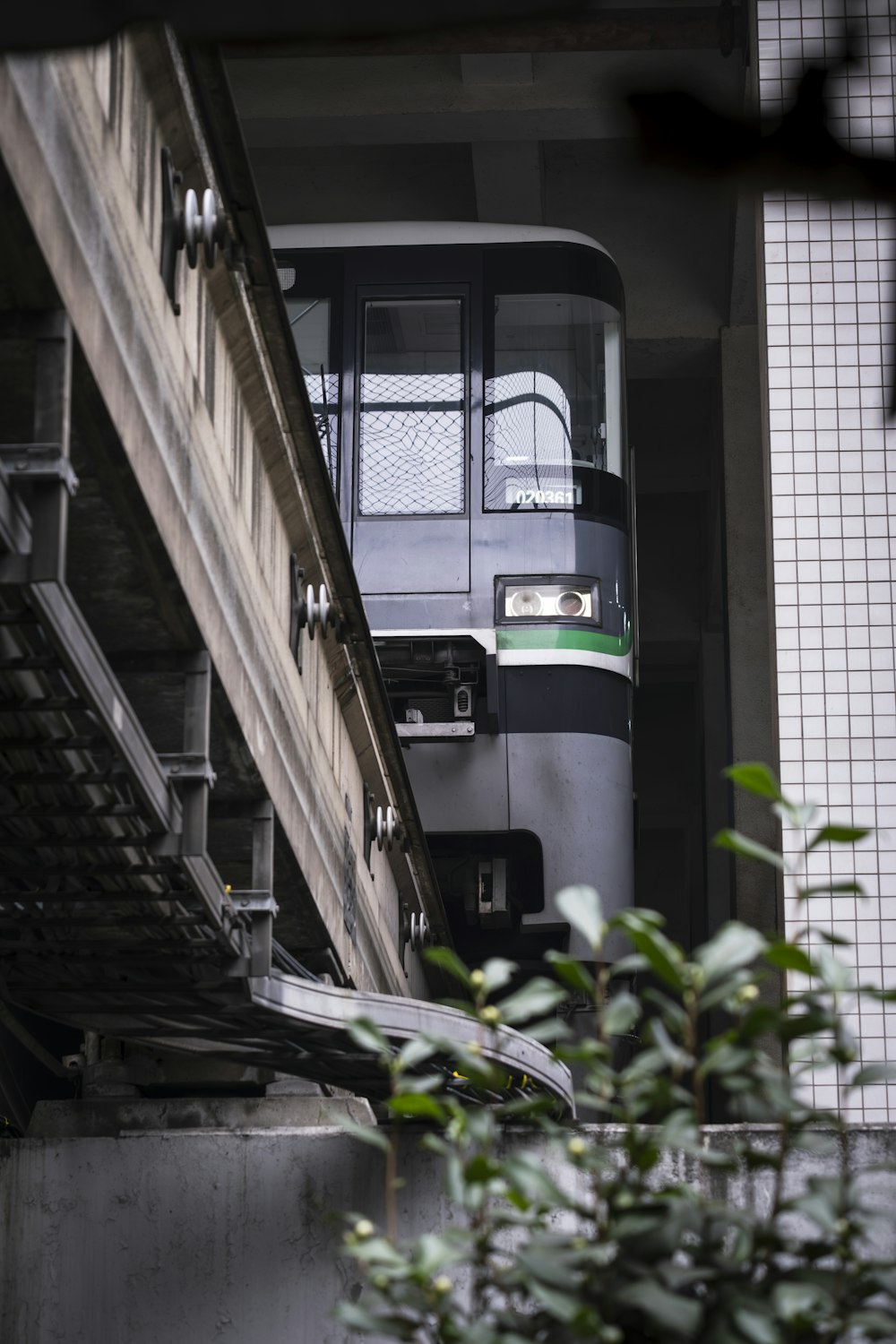 a train is going down the tracks near a building