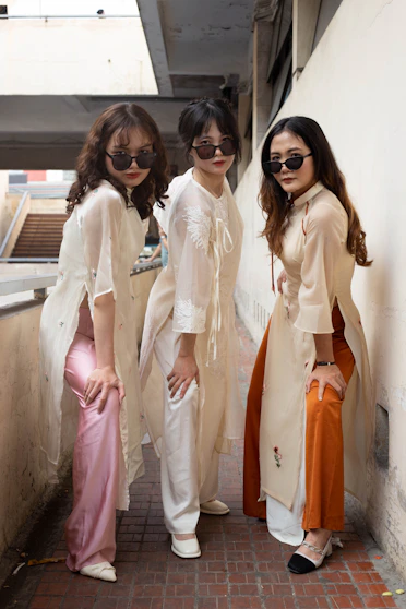 three young women standing next to each other
