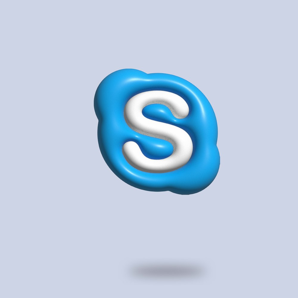 a blue and white letter s floating in the air