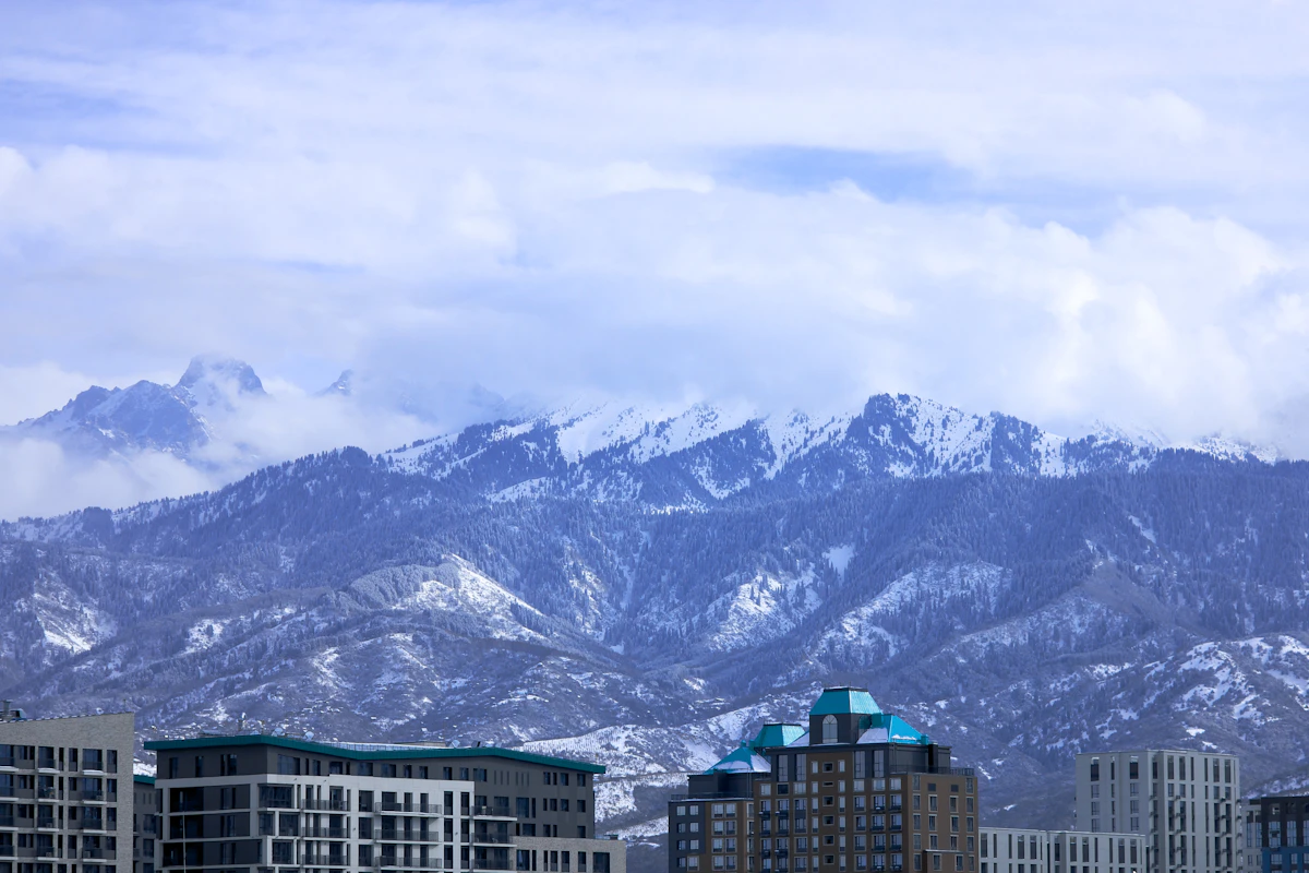 Almaty city skyline backed by snow-capped Tian Shan mountains, Kazakhstan